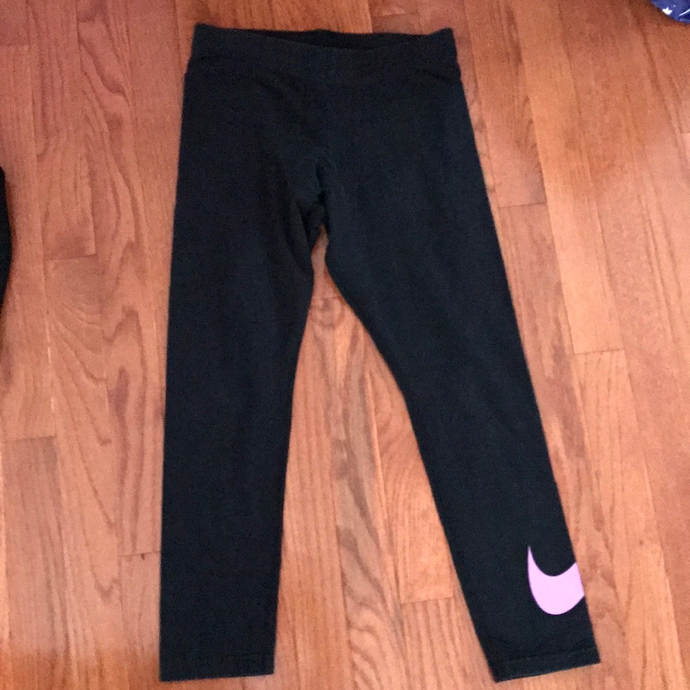 Nike black leggings with a swoosh.